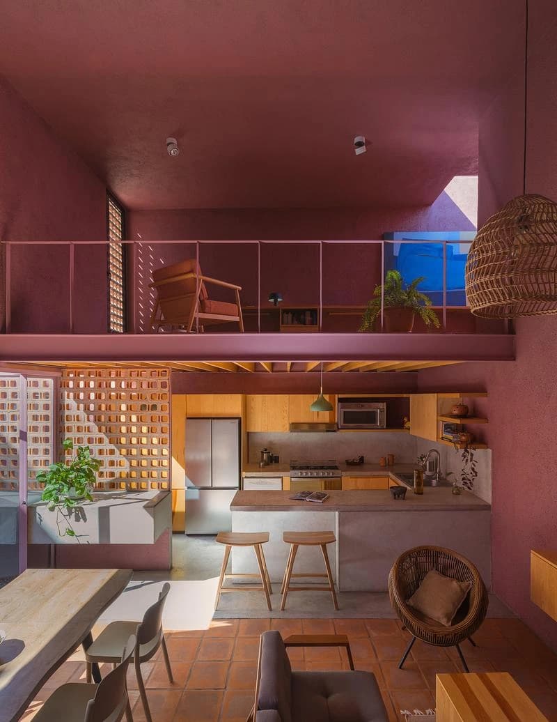 Living room beneath the mezzanine with warm-toned joinery · LGM Studio · via v2com