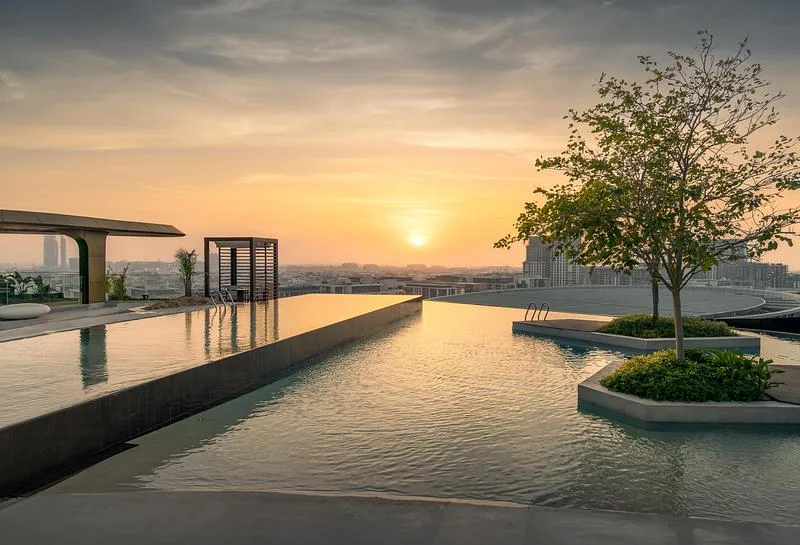 The outdoor pool facing the sunset · Ahmad Alnaji - SARAB · via v2com