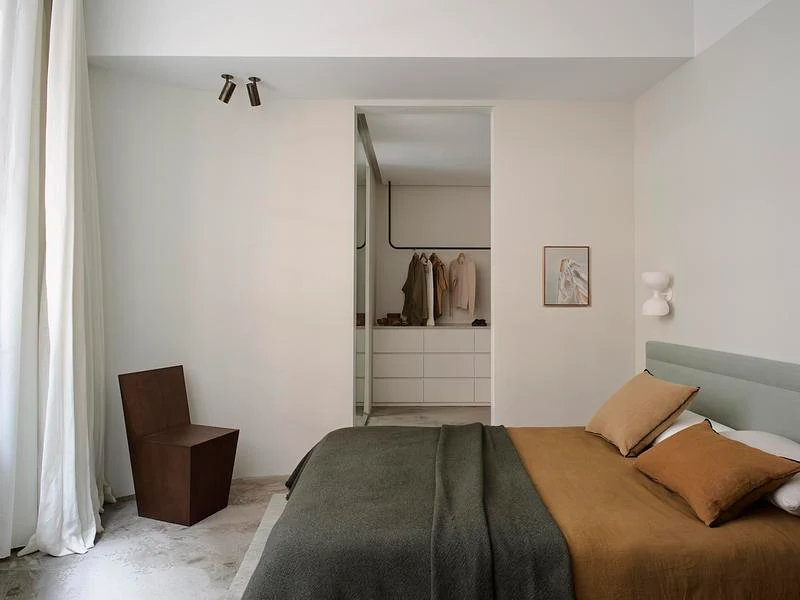 Bedroom with muted green and ochre textiles · Anson Smart · via v2com