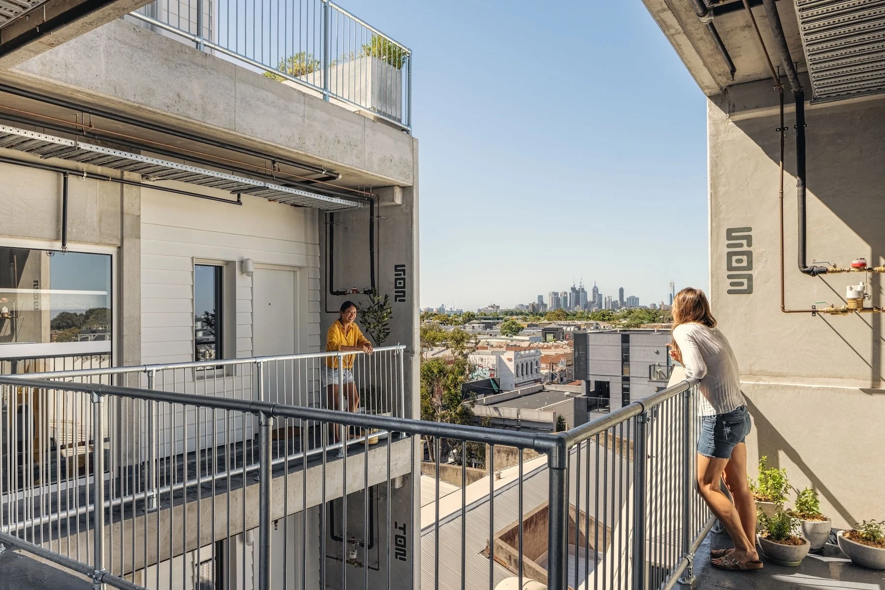 Shared outdoor circulation and terraces · Photography © Maitreya Chandorkar