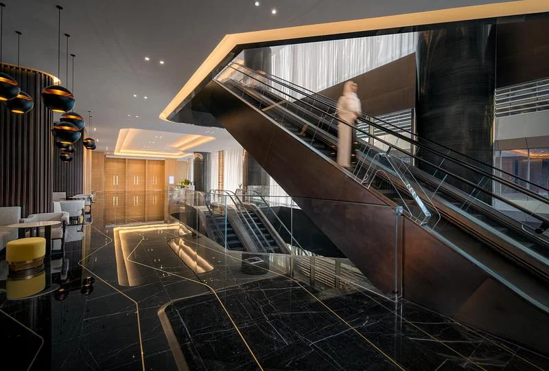 A staircase within the hotel interior · Ahmad Alnaji - SARAB · via v2com